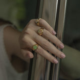 WILHELMINA GARCIA Gold Clover Signet Ring in Green